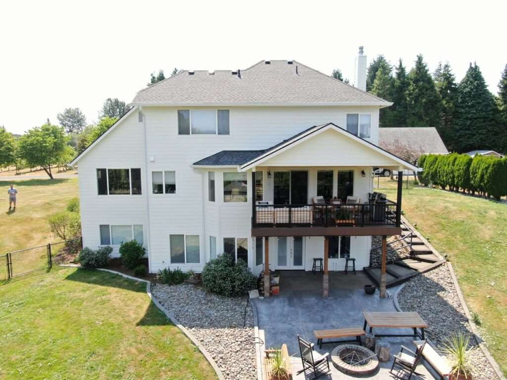 Full exterior home transformation featuring new roof replacement and premium siding in Ridgefield, Washington by Armadas Exterior.