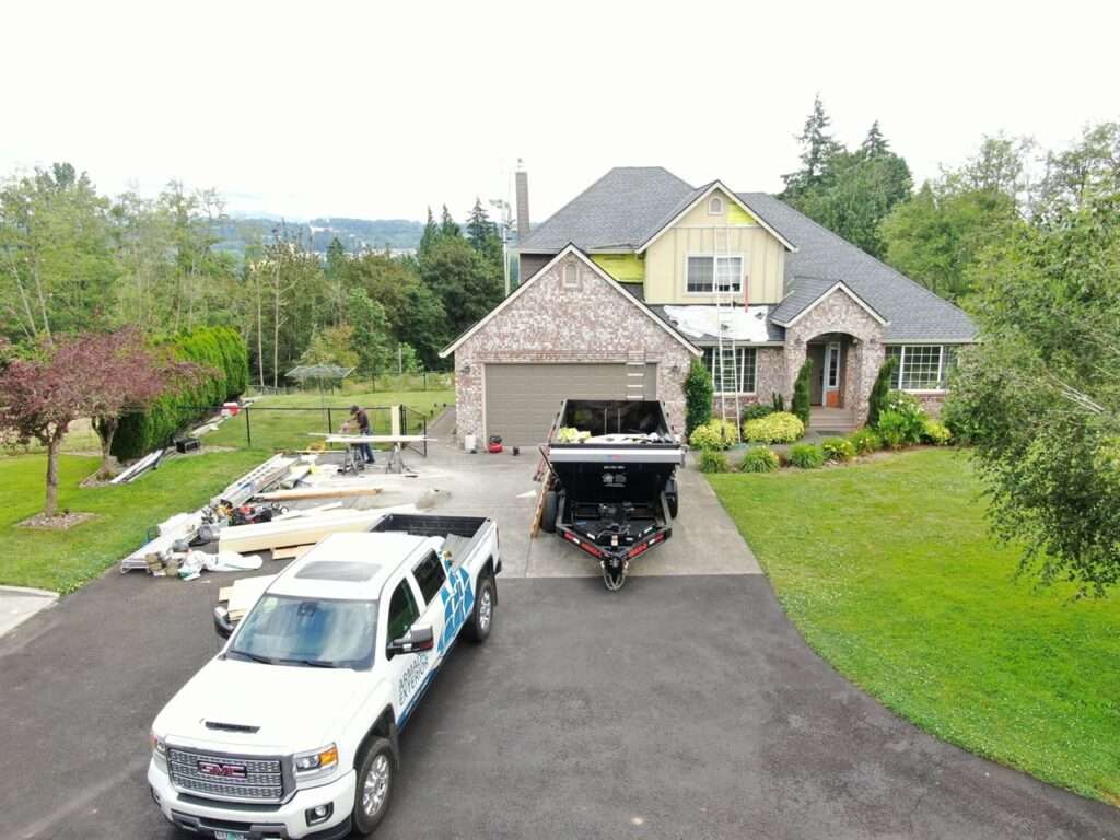 Completed residential exterior renovation showcasing new siding and a full roof replacement in Ridgefield, Washington by Armadas Exterior.