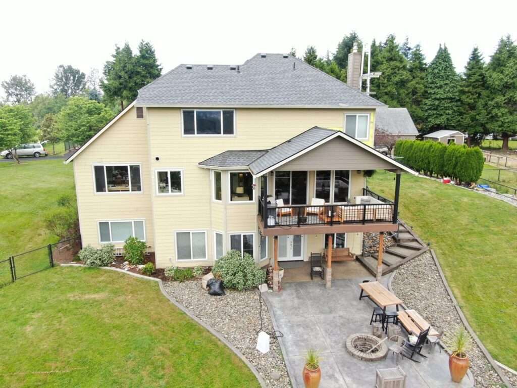 Weatherproofed residential exterior remodel featuring professional siding and a new roof replacement in Ridgefield, Washington by Armadas Exterior.