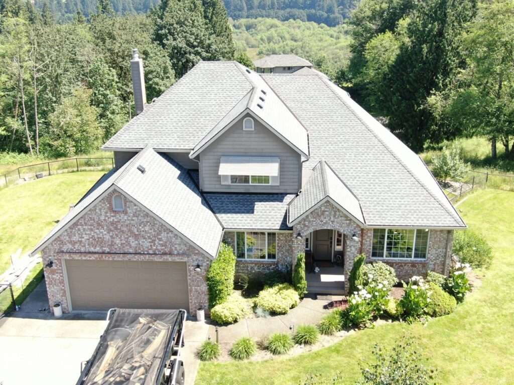 High-quality architectural roof replacement and new siding installation on a home in Ridgefield, Washington by Armadas Exterior.