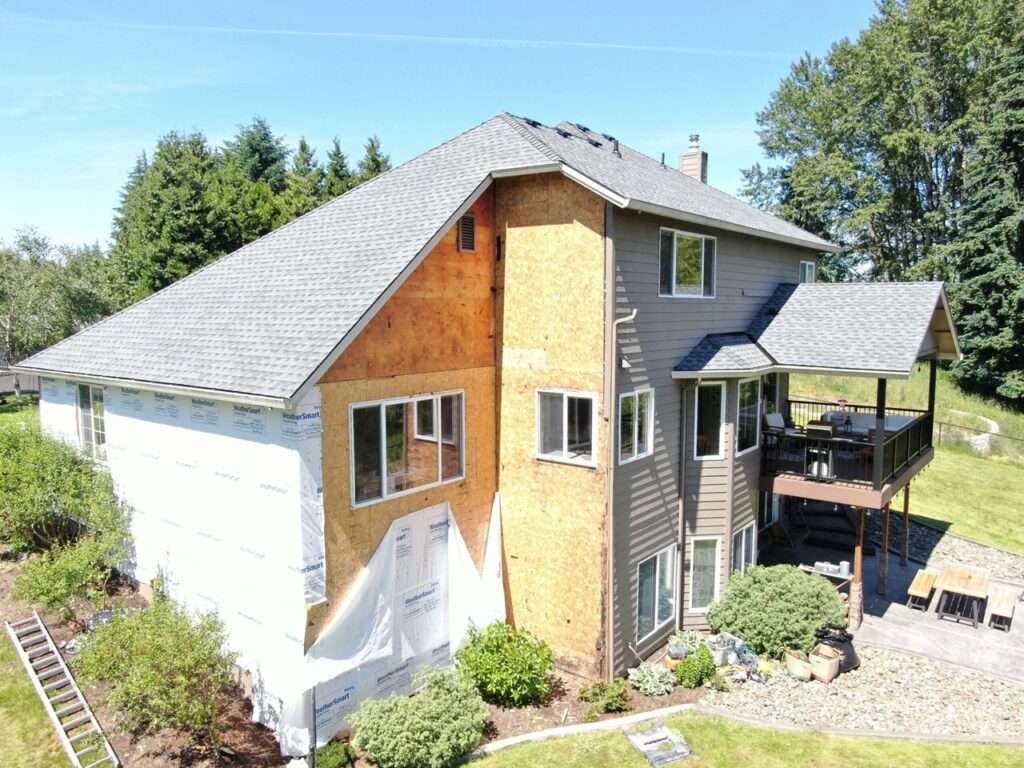 Precision residential exterior upgrade featuring brand-new siding and a full roof replacement in Ridgefield, Washington by Armadas Exterior.