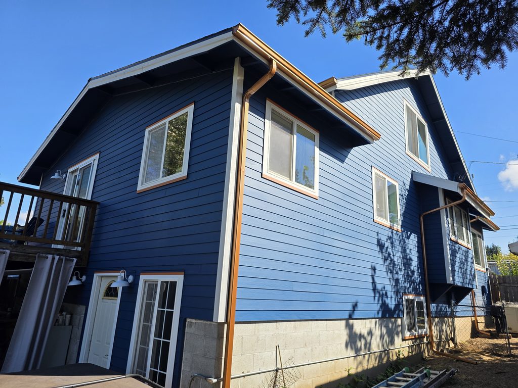 Back corner of the house with the new paint and gutters