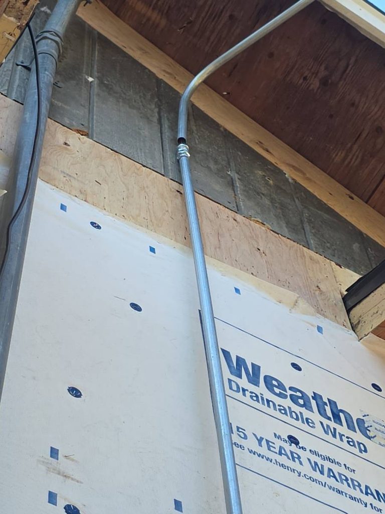 Plywood and T1-11 are butted together revealing unlevel walls.