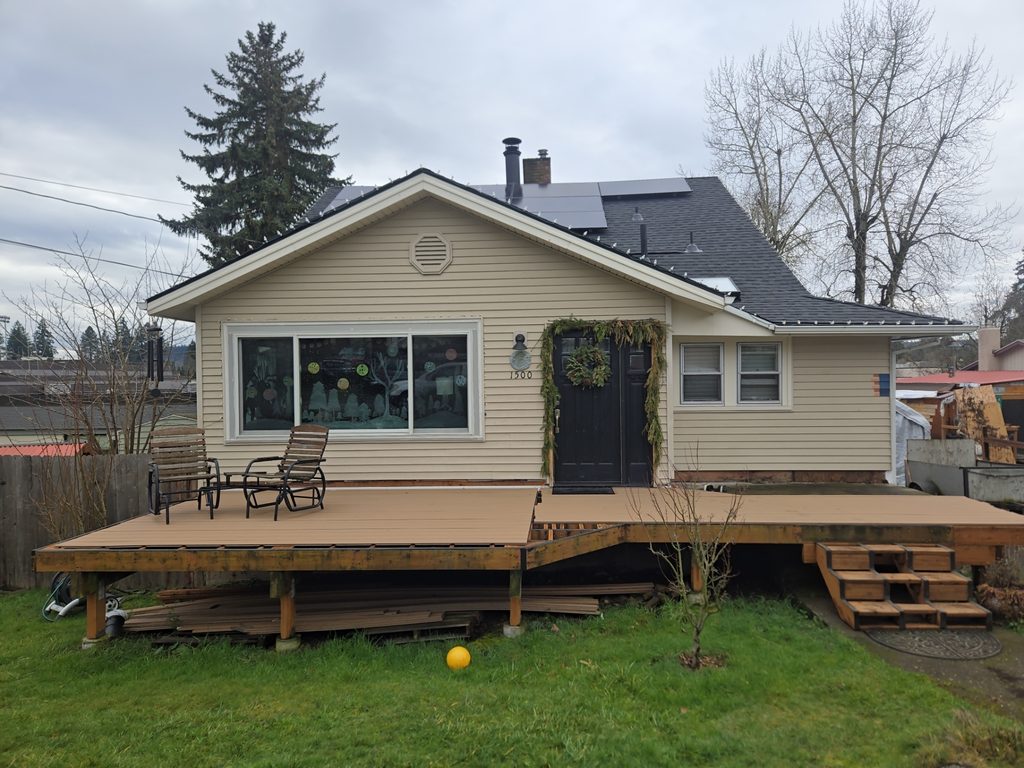 Vinyl sided house before the project begins