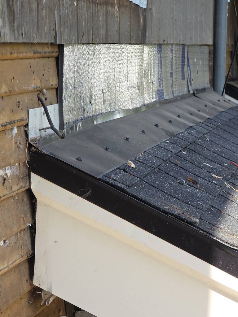 Roof to wall flashing is not even inserted correctly because the siding was unlevel.