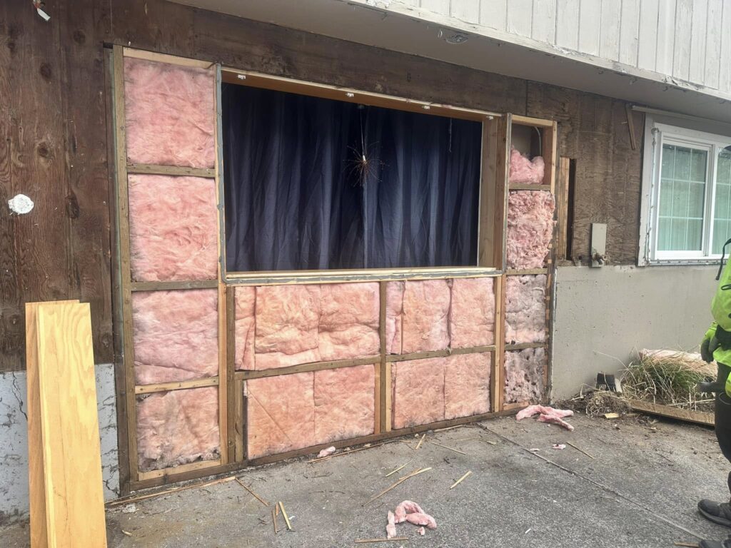Lower section of split level house needed windows reframed.