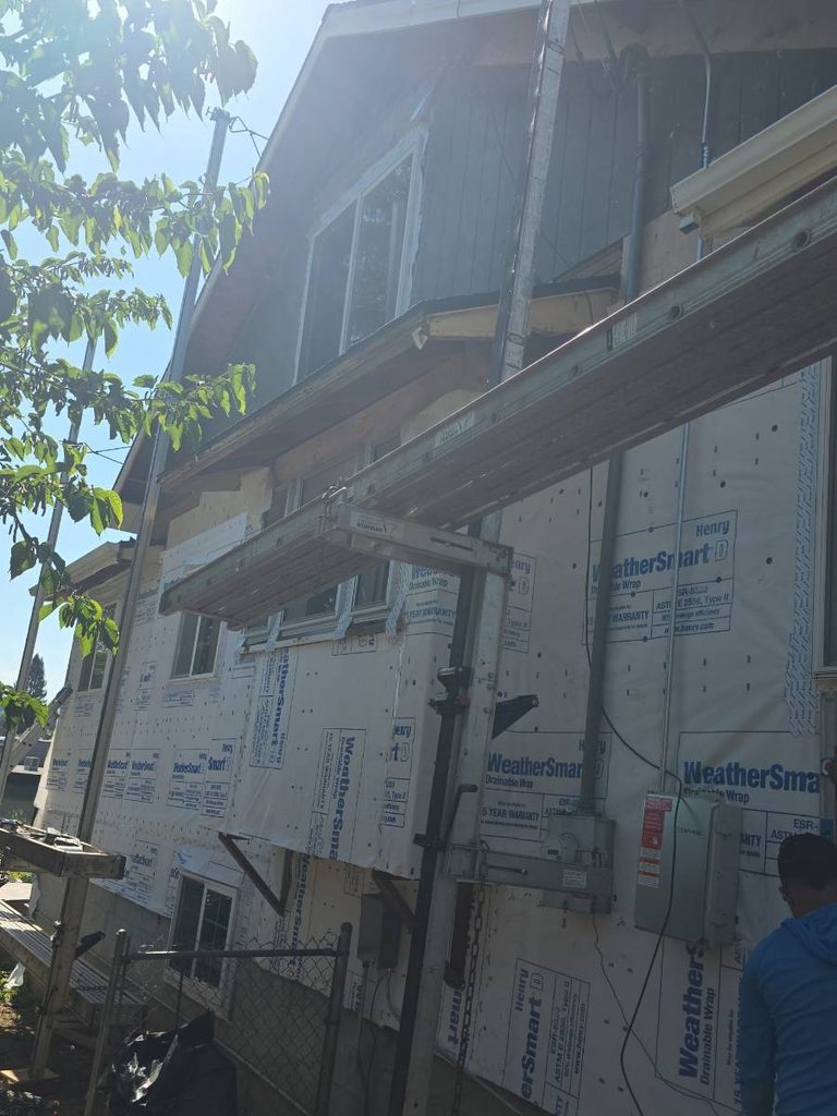 Scaffolding set up to remove all of the vinyl siding