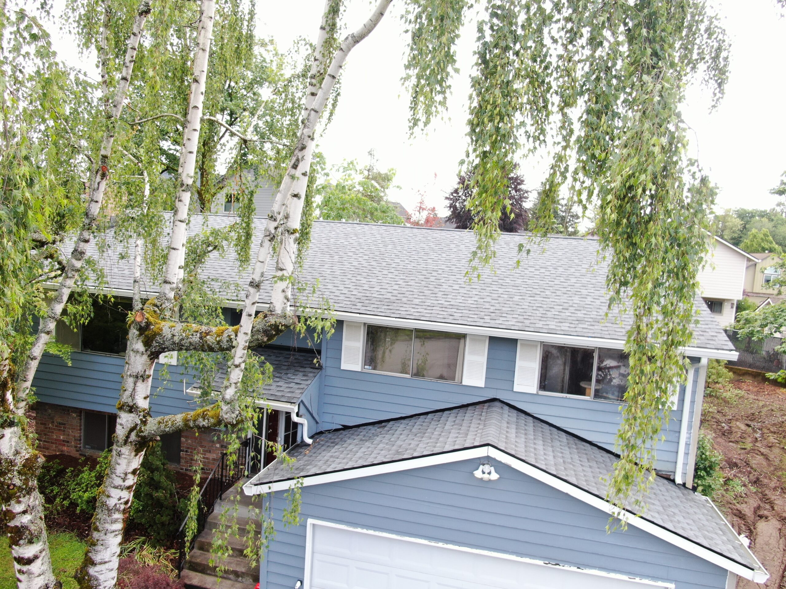 Completed roof replacement on the Nelson home in Gresham after major tree and storm damage