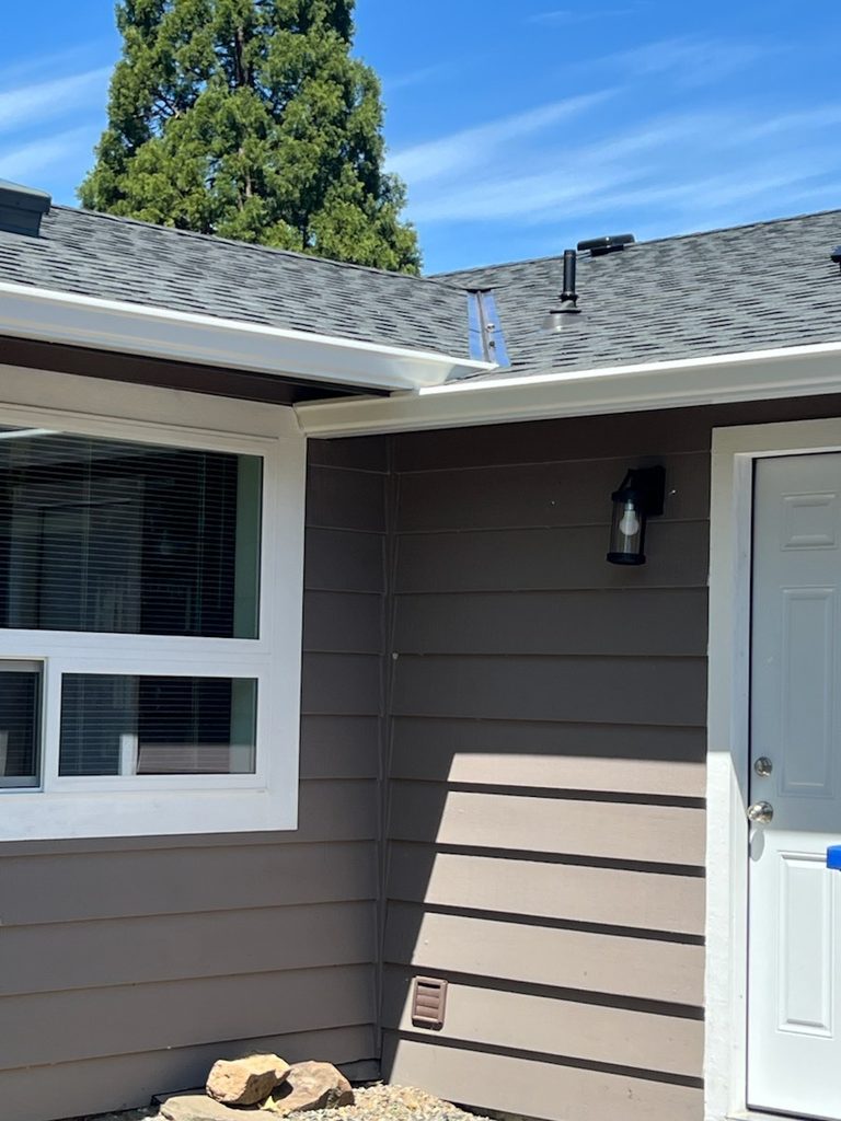 Completed seamless 6-inch K-style gutter along a complex Happy Valley roofline